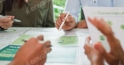 Preview: Closeup group Asia businesspeople talk ESG strategies risk management workshop.
