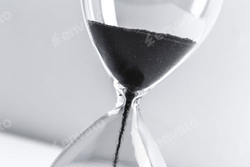 Preview: Close up hourglass on table