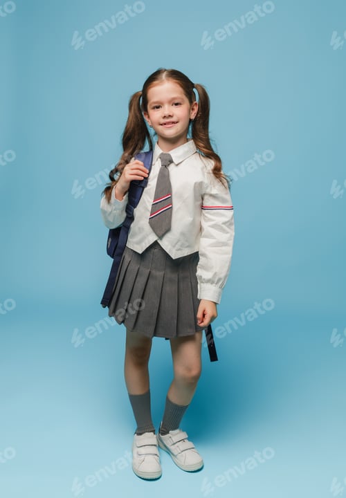 Preview: Smiling Girl in School Uniform with Backpack