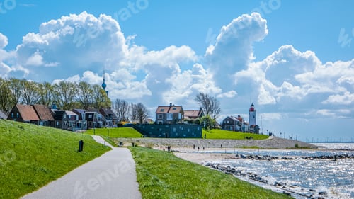 Preview: Urk Flevoland Netherlands sunset at the lighthouse and harbor of Urk Holland. Fishing village Urk