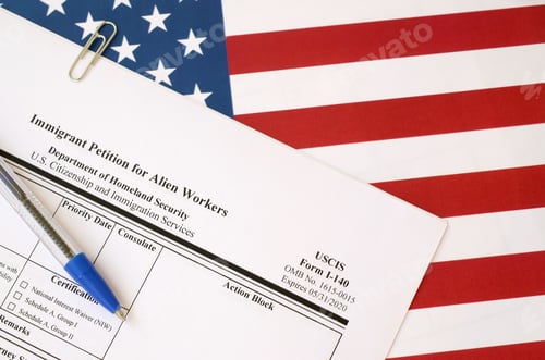 Preview: I-140 Immigrant petition for alien workers blank form lies on United States flag