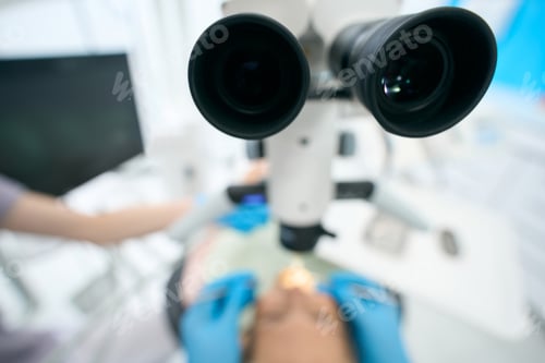 Preview: Dentist working with patient and special equipments