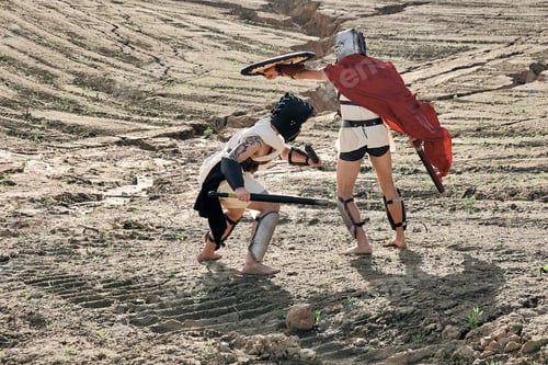 Preview: A Concept Photo Of A Roman Battle Of Two Warriors Of The Colosseum In Action With Aggressive