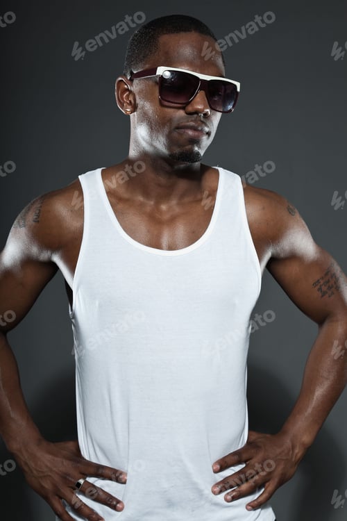 Preview: Cool Urban Stylish Black American Man. Fashion Studio Portrait Isolated On Grey Background. Wearing