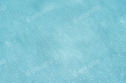 Preview: Surface of blue or turquoise swimming pool with clear water ripple waves for wallpaper