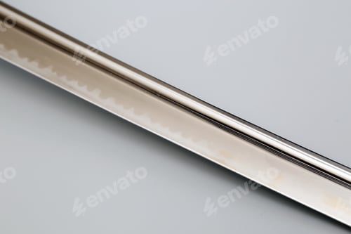 Preview: Closeup shot of the sharp blade of a traditional Japenese katana sword