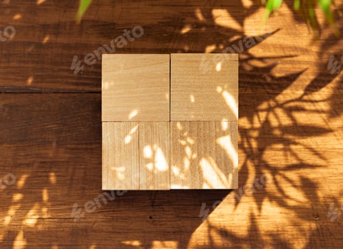 Preview: Groupped wooden square blocks on dark wooden table