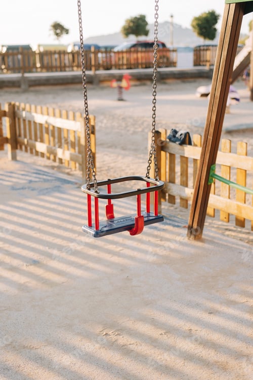 Preview: Detail of a toddler swing on a kids playground