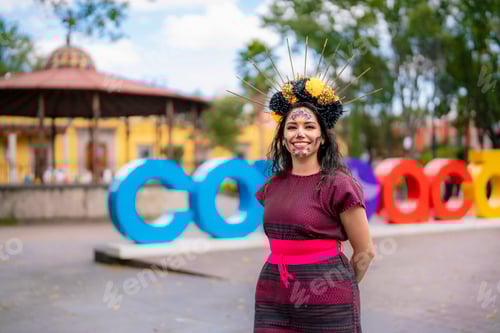 Preview: Young Latina in handmade dress with catrina makeup celebrates DĂa de Muertos at Coyoacán