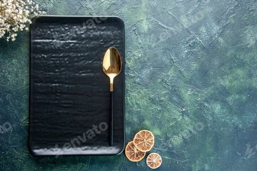 Preview: top view black plate with golden spoon on dark-blue background food restaurant cutlery meal service