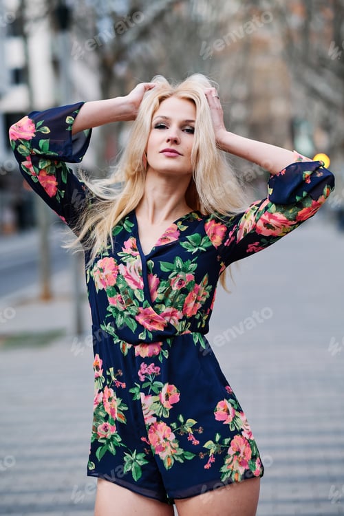 Preview: Sensual blonde woman posing in the street