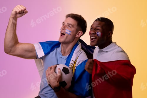 Preview: Happy diverse male supporters with national flags over pink lighting
