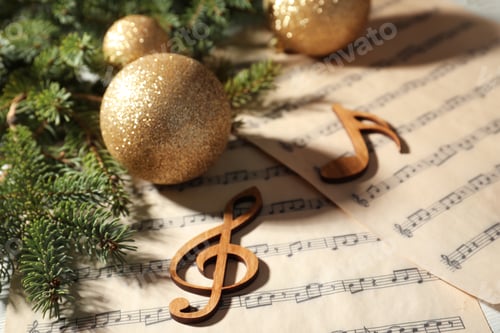 Preview: Composition with Christmas balls and wooden music notes on table