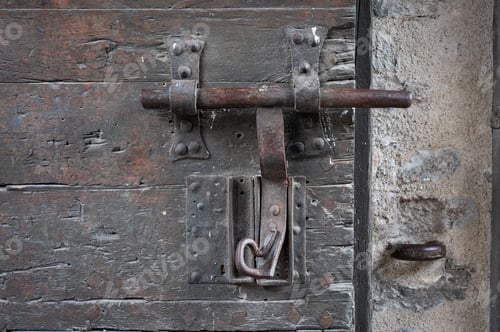Preview: Detail of the old bolt or latch made in the forge of an old medieval wooden door