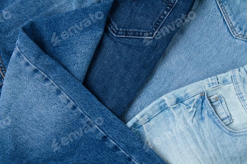 Preview: Flat lay of classic blue jeans. Urban outfit, basic essencial wardrobe, shopping concept. Top view