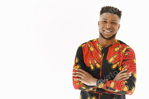 Preview: African young man posing against white wall
