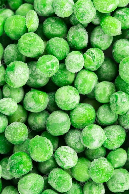 Preview: Close up of frozen Green Peas.