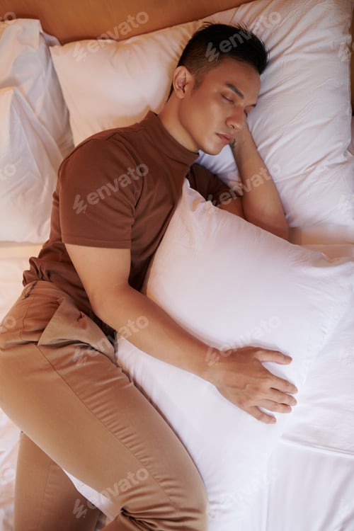 Preview: Man Sleeping with Pillow Between Legs