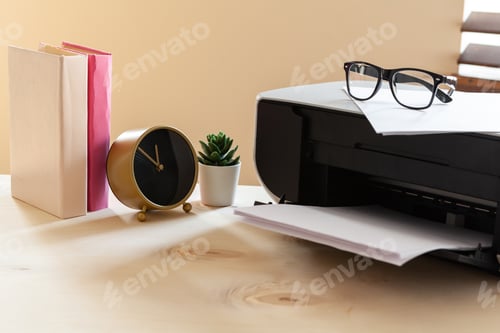 Preview: Close up of an office table with printer on it
