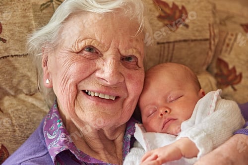 Preview: Cherished moments as a grandmother cradles a sleeping newborn.
