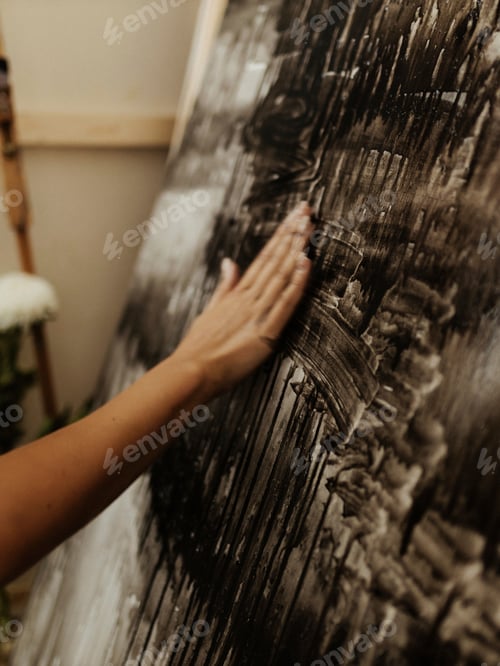 Preview: Motion blur pic.Human body art. Painting process. Creative person with flowers and paint brushes