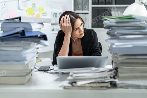 Preview: Frustrated Asian young businesswoman overwork late in office at night.