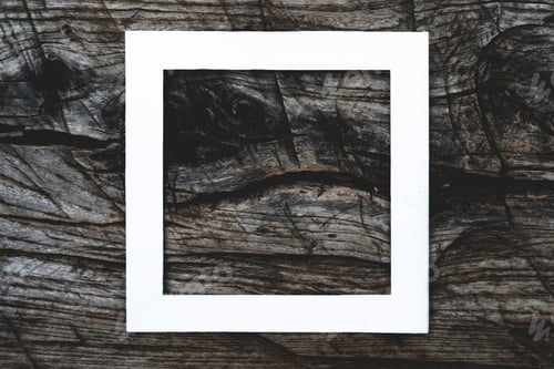 Preview: f overhead top view of white square frame on top of dark wooden scratched surface mock up concept, c