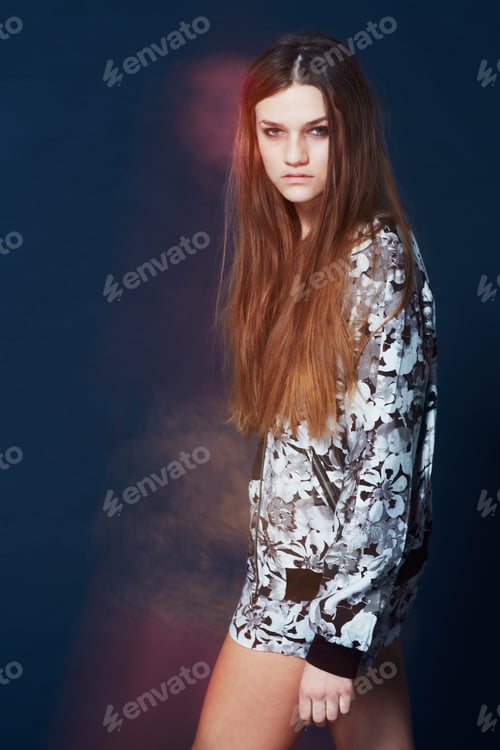 Preview: Portrait of a gorgeous young model walking passed the frame in blurred motion