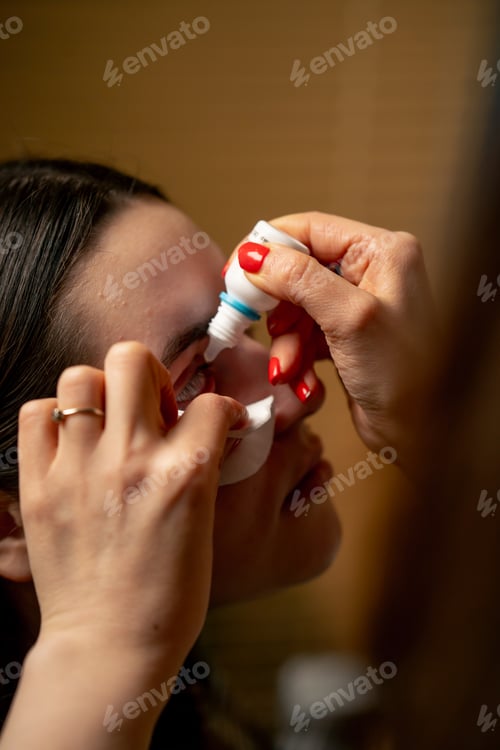 Preview: close-up in an ophthalmology clinic Freezing drops are put into a girl's eye