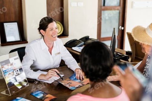 Preview: Resort receptionist speaking to a guest
