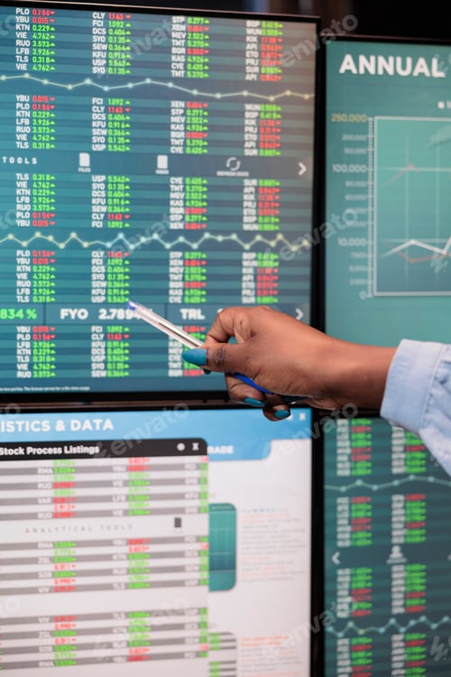 Preview: Close up shot of forex stock market trader woman pointing at screen showing real time trading data.