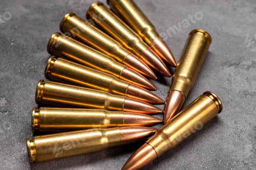 Preview: Pile of Bullets on a Gray Surface