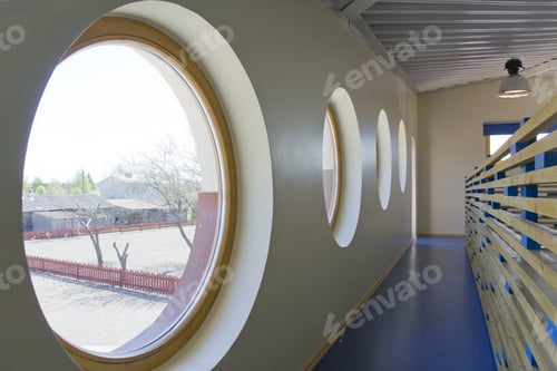Preview: Round Windows in a school corridor.