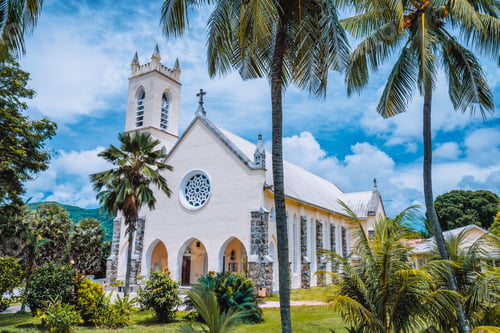 Preview: Mahe Island, Seychelles. St Roch Roman Catholic Church between palm trees near Beau Vallon location