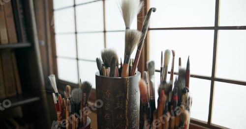 Preview: Paint brush, equipment and supplies in empty studio closeup for art, creative or talent showcase. W