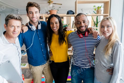 Preview: Portrait of confident business team standing in loft office