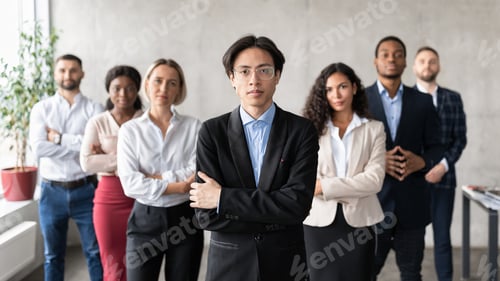 Preview: Asian Businessman Posing Standing With His Employees Team In Office