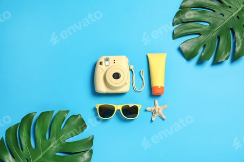 Preview: Flat lay composition with beach accessories on color background