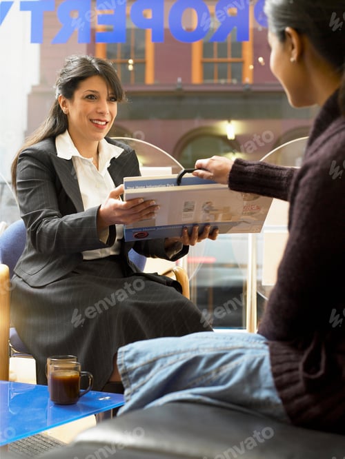 Preview: Realtor offering information to client