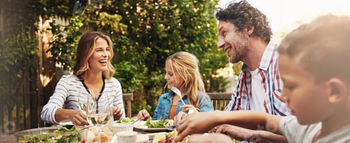 Preview: Happy, parents and children at outdoor lunch with smile, celebration or family eating together in b