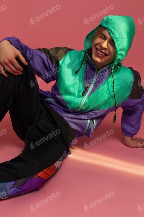 Preview: A Guy Hipster In A Sports Suit Posing On A Pink Background
