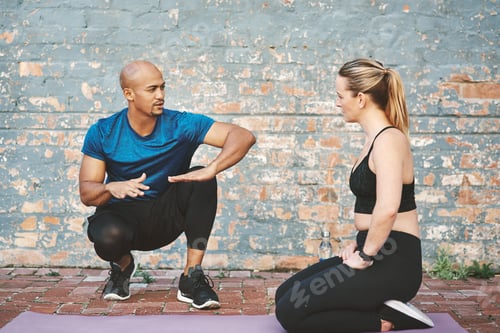 Preview: He gives clear instructions. Shot of a young woman working out with her personal trainer.