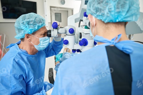 Preview: Medical worker and intern doing laser vision correction operation