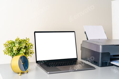 Preview: Printer and laptop on grey table in office