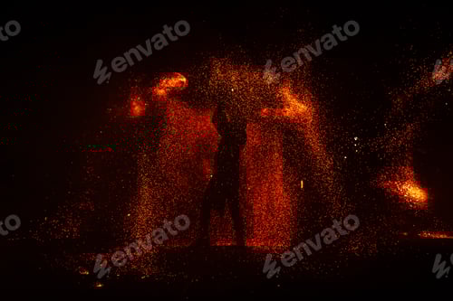 Preview: Fire show, dancing with flame, male master juggling with fireworks, performance outdoors,