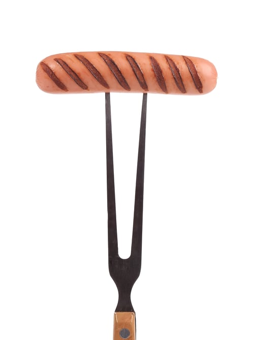 Preview: Grilled sausage on a fork.