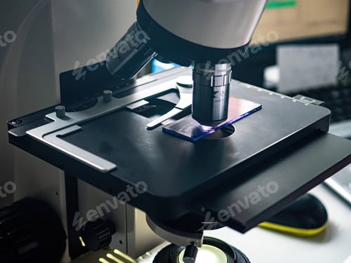 Preview: Laboratory technician, laboratory assistant, looks into a microscope and makes a blood test. Diagnos