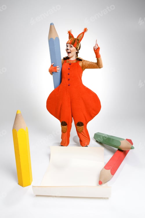 Preview: Young Woman In Image Of Squirrel With Large Pencils