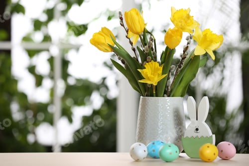 Preview: Festive composition with Easter eggs on table against blurred window, space for text