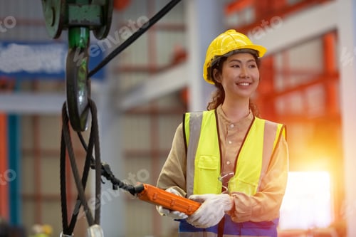 Preview: woman engineer technical department working in power plant control panel of industry factory.